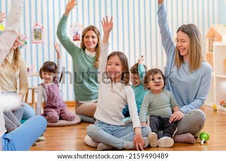 Parents taking part in the activities for preschool children. Healthy learning environment. Teacher and parents working together. Royalty-Free Stock Photo #2159490489