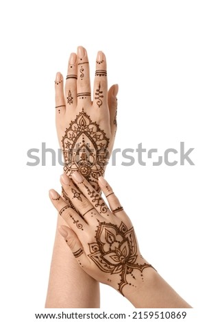 Female hands with beautiful henna tattoo isolated on white background
