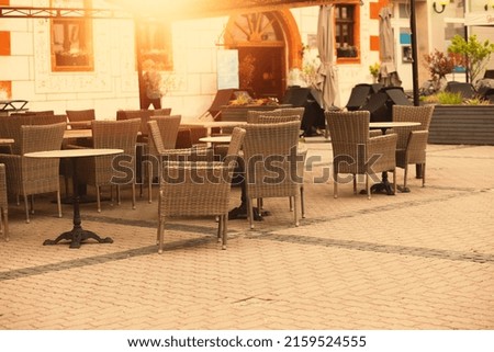 Empty restaurant summer terrace with tables and chairs. High quality photo