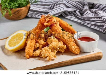 Traditional asian appetizer - crispy shrimps with sauce. Tempura shrimps on wooden board. Prawn tempura in panko breaded with spicy sauce. Pan asian food. Summer menu Royalty-Free Stock Photo #2159533121