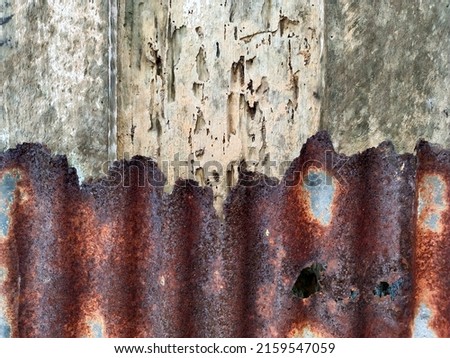 selected blurred background,the texture wall of old house, damage wooden planks and zink is rusty, landscape photography