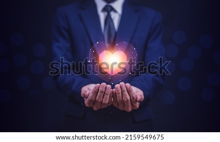 hands holding digital heart on visual screen , health care, love, organ donation,world heart day, world health day, Royalty-Free Stock Photo #2159549675