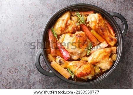 Homemade chicken stew with rhubarb, rosemary and white wine close-up in a frying pan on the table. horizontal top view from above
 Royalty-Free Stock Photo #2159550777