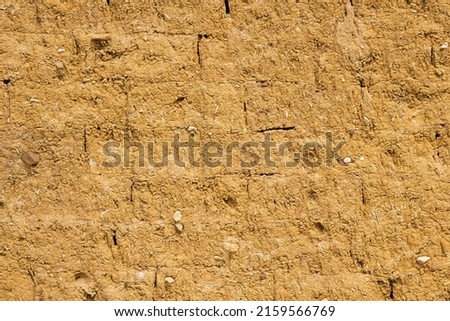 Wall for background or texture of mud and straw bricks (adobe) baked in the sun 