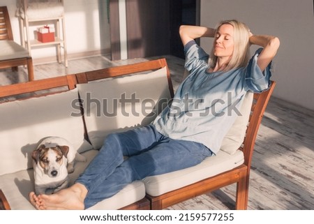Calm 40s female at home on couch put hands behind head, middle aged woman feels good resting in modern cozy living room alone. No stress and anxiety, enjoy fresh air, do relaxing exercise concept
 Royalty-Free Stock Photo #2159577255