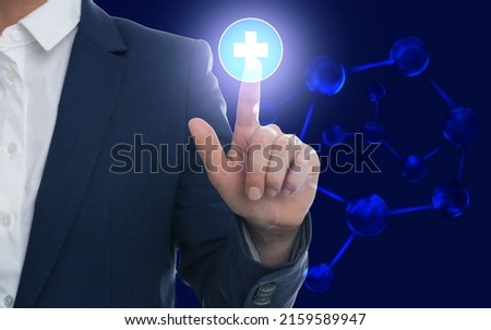 Woman pressing virtual first aid button on blue background, closeup. Emergency help