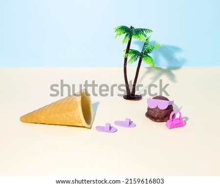 Creative look of summer pastel ice cream coming out of the cone on pastel blue and beige backgrounds. A modern fun surreal idea of ice cream on the beach.