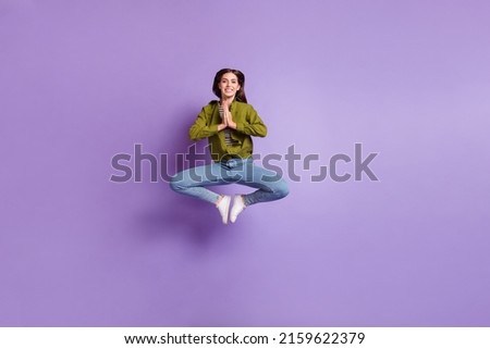 Full size picture of good mood lovely lady jumping up in yoga pose practice zen isolated on purple color background
