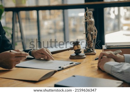 judge, male lawyer, businessman's legal services business advisor Consulting on various contracts to plan a case in the court of justice, and team meetings are held at the law firm.