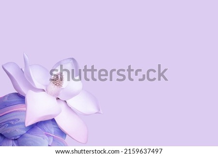 Beautiful lotus flower symbol of Zen and yoga on a lilac background.