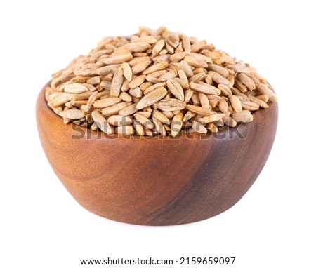 Rye grains isolated on white background. Pile of rye malt seeds in wooden bowl. Dry grains of winter rye Royalty-Free Stock Photo #2159659097