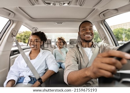 Car Sales. Cheerful African American Family Riding New Automobile Traveling On Vacation. Happy Parents And Daughter Enjoying Road Trip In Summer. Transportation And Vehicle Purchase Royalty-Free Stock Photo #2159675193