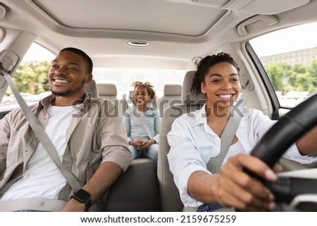 Family Having Car Ride, Woman Driving Enjoying Road Trip With Husband And Daughter On Summer Vacation. Auto Leasing And Purchase. Transportation And Traffic Concept. Selective Focus Royalty-Free Stock Photo #2159675259