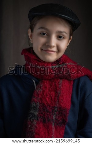 Portrait of a beautiful young girl in a home photo studio. artistic noise.