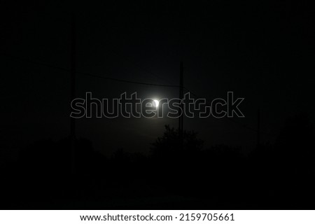 a pole and a beautiful moon picture