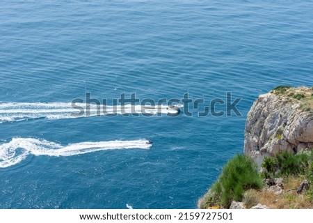 WATER MOTORCYCLE AND BOAT IN CAPE OF THE NAO,JAVEA,ALICANTE,SPAIN