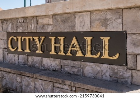 Close-up of City Hall sign.