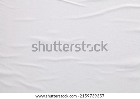 Gray beige crumpled wet craft paper blank texture copy space background. Royalty-Free Stock Photo #2159739357