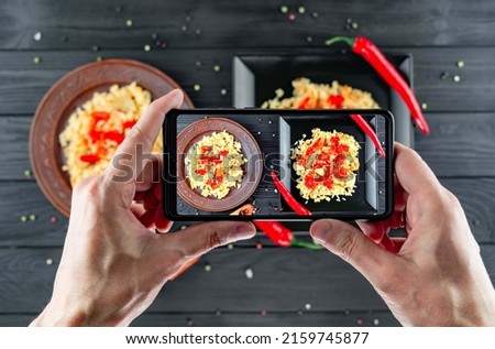 Photographing food on a mobile phone. Professional photography of food in the studio on a mobile phone.