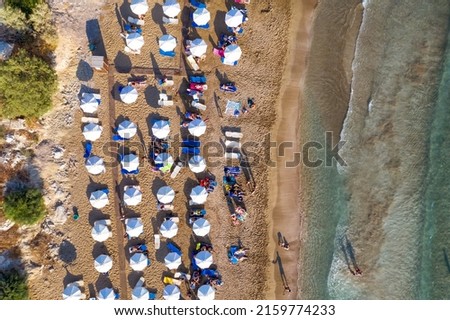 People enjoying nice summer day at Coral Bay beach. Peyia village, Paphos District, Cyprus Royalty-Free Stock Photo #2159774233