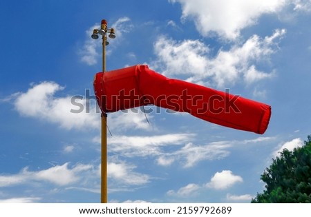 windsock inflated of air in heliport with blue sky on background. Sao Paulo city, Brazil