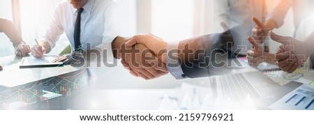 Businessman handshake for teamwork of business merger and acquisition,successful negotiate,hand shake,two businessman shake hand with partner to celebration partnership and business deal concept. Royalty-Free Stock Photo #2159796921