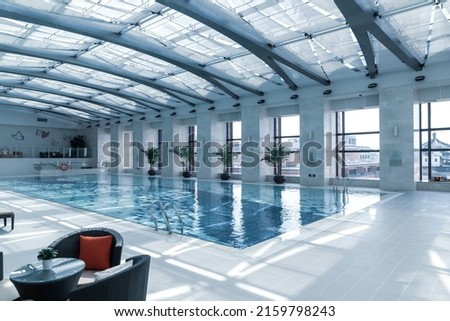 Luxury indoor swimming pool, part of luxury hotel. Royalty-Free Stock Photo #2159798243