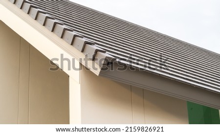 Eaves close-up. Low angle shot, eaves of a modern house,  Modern style eaves corner, beautiful, luxurious. Modern house design concept. Royalty-Free Stock Photo #2159826921