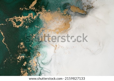 Marble ink abstract art from exquisite original painting for abstract background . Painting was painted on high quality paper texture to create smooth marble background pattern of ombre alcohol ink . Royalty-Free Stock Photo #2159827133