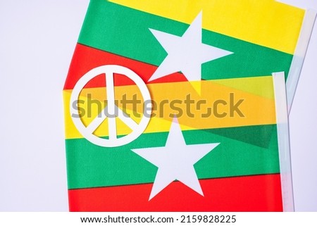 Support for Myanmar people, peace dove with flag of Myanmar. Freedom, stop war, dictatorship and democracy concepts