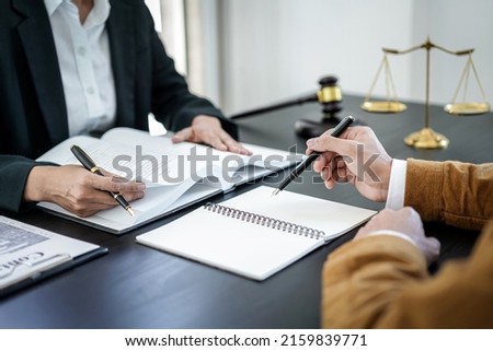 Businesswoman and Male lawyer or judge consult and conference having team meeting with client at law firm in office, Law and Legal services concept. Royalty-Free Stock Photo #2159839771