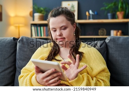 Young Woman With Disability Using Tablet Royalty-Free Stock Photo #2159840949