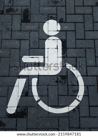 International handicapped symbol painted on a parking space. 