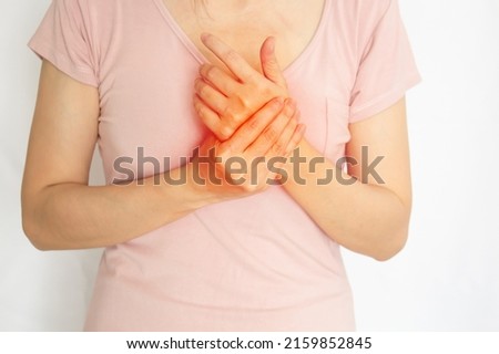 women are rubbing hand with pain syndrome and feel numb  