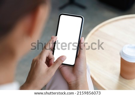 close-up a woman holding and touch smartphone blank screen Royalty-Free Stock Photo #2159856073