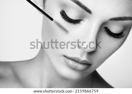 Beautiful Woman with Extreme Long False Eyelashes. Eyelash Extensions. Makeup, Cosmetics. Beauty, Skincare. Black and White photo Royalty-Free Stock Photo #2159866759