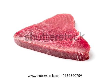 Raw tuna steak isolated. Red sea fish fillet, fresh tuna filet, seafood sashimi, bluefin piece, akami, ahi loin, albacore meat cut on white background Royalty-Free Stock Photo #2159890759
