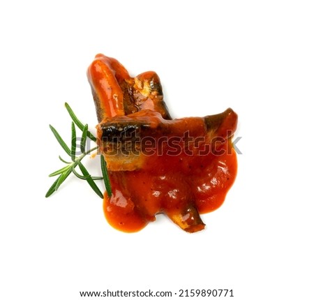 Fish in tomato sauce isolated. Fried herring, sprat fillet, canned mackerel with ketchup, saury in red sauce on white background top view