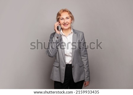 Smart perfect senior woman phone. Mature business lady with smartphone