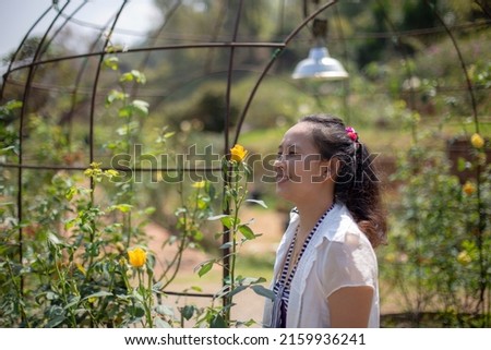 Photo of Asian woman in park and blurred background