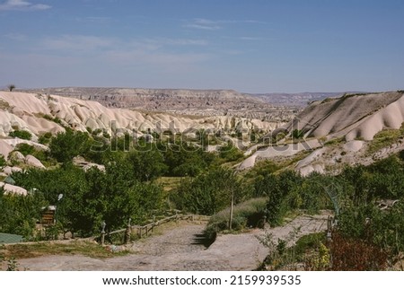 The unreal world of Cappadocia. A sunny day in the famous village of Uchisar, district of Nevşehir province in the Central Anatolian region of Turkey.