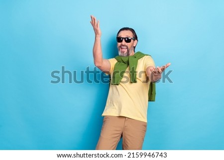 Photo of overjoyed person raise arms have fun good mood toothy smile isolated on blue color background Royalty-Free Stock Photo #2159946743