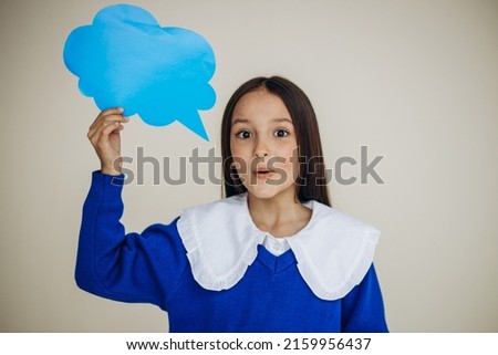 School girl holding speech bubble