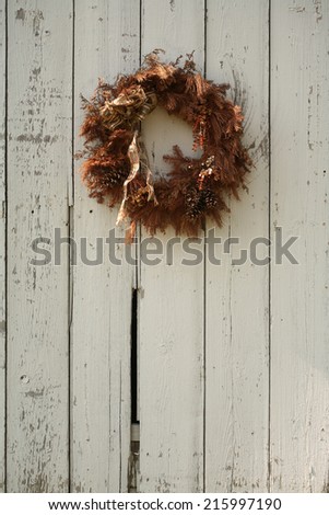 wreath on white barn