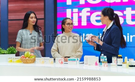 TV Talk Show Infomercial: Diverse Female Professionals Present Mock-up Beauty Products Boxes. Host, Expert, Doctor Talk Health Care Supplements, Cosmetics. Playback Television Advertisement Commercial