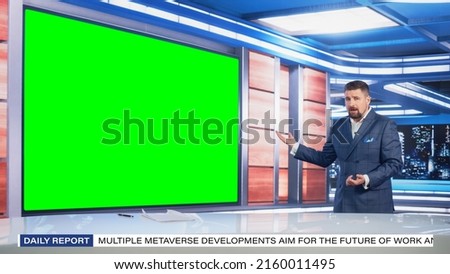 Talk Show TV Program: Handsome White Male Presenter Standing in Newsroom Studio, Uses Big Green Chroma Key Screen. News Achor, Host Talks About News, Weather. Mock-up Cable Channel Concept.