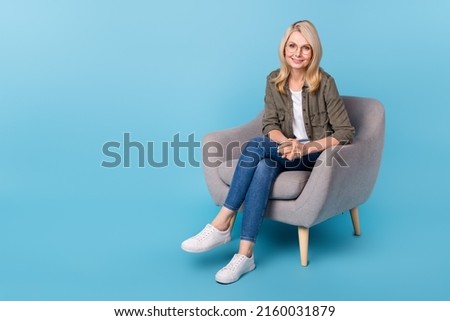 Photo of aged lady psychology specialist sit chair listen client patient isolated blue color background Royalty-Free Stock Photo #2160031879