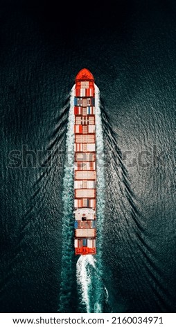container ship sailing full speed to transport goods logistics in containers for import export internationally and worldwide, business services transportation by container ship open dark sea, top view