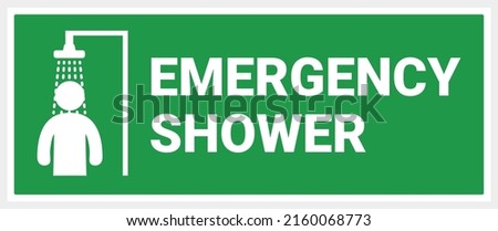 Arrow to emergency shower. green background