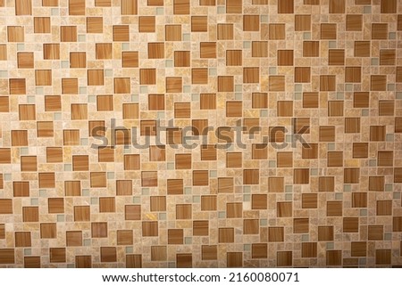 A view of a pattern of glass wall tiles, as a background.